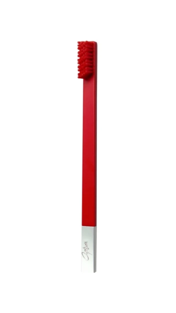 A medium toothbrush with a carmine red handle and a silver brush head, with the brand name 'APRIORI' visible on the handle.