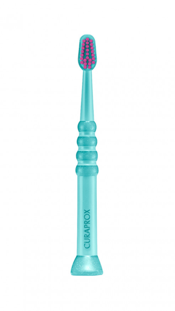 A blue children's toothbrush with a soft rubber handle and a rounded brush head, designed for ages 0-4 years.