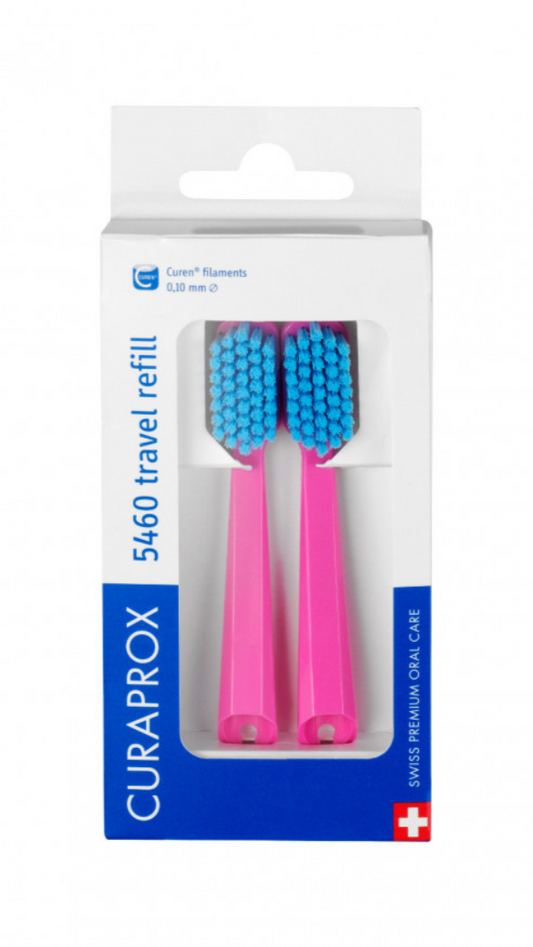 Packaging of Curaprox orthodontic toothbrush replacement heads with yellow handles and blue bristles.