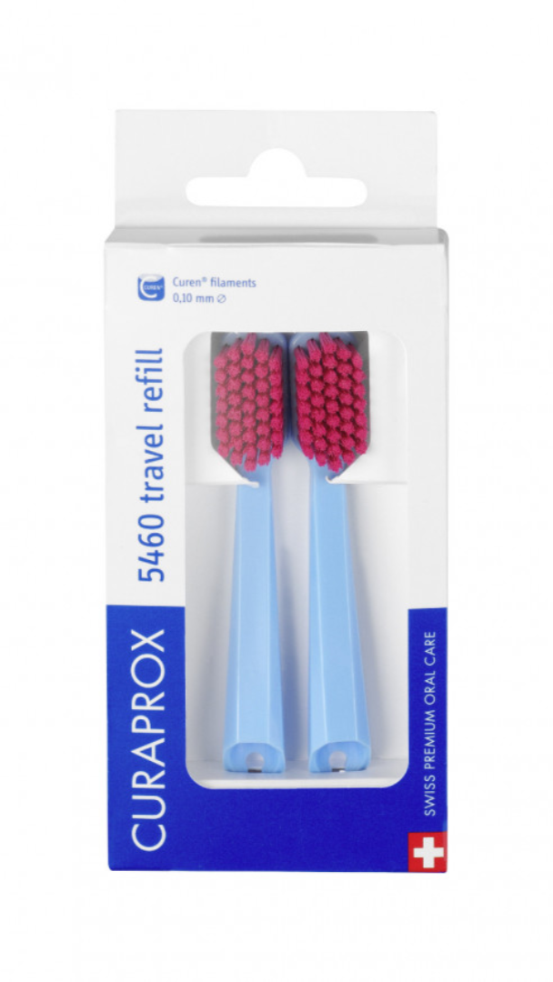 Packaging of Curaprox orthodontic toothbrush replacement heads with yellow handles and blue bristles.
