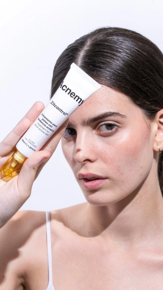 Woman holding a skincare product with a white background