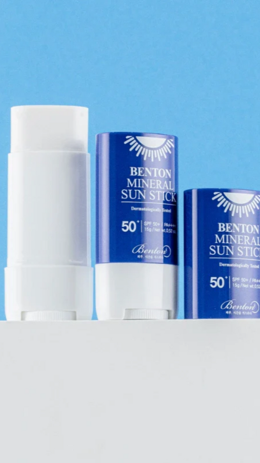 Benton Mineral Sun Stick with blue packaging on a white and blue background