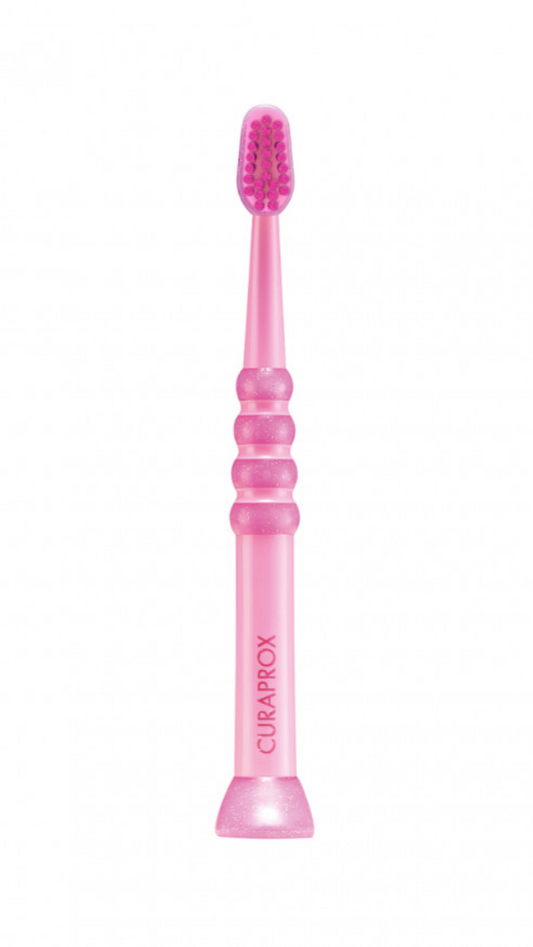 A blue children's toothbrush with a soft rubber handle and a rounded brush head, designed for ages 0-4 years.