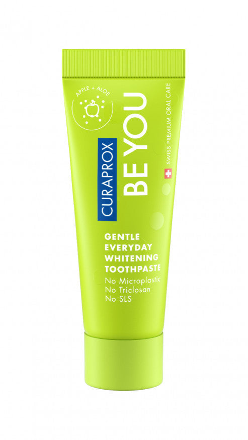 A range of toothpaste tubes in various colors, each labeled Be You Curaprox.