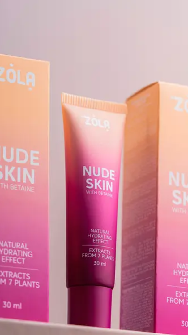 Three tubes of ZOLA Nude Skin foundation with varying shades of pink, indicating different skin tone matches.