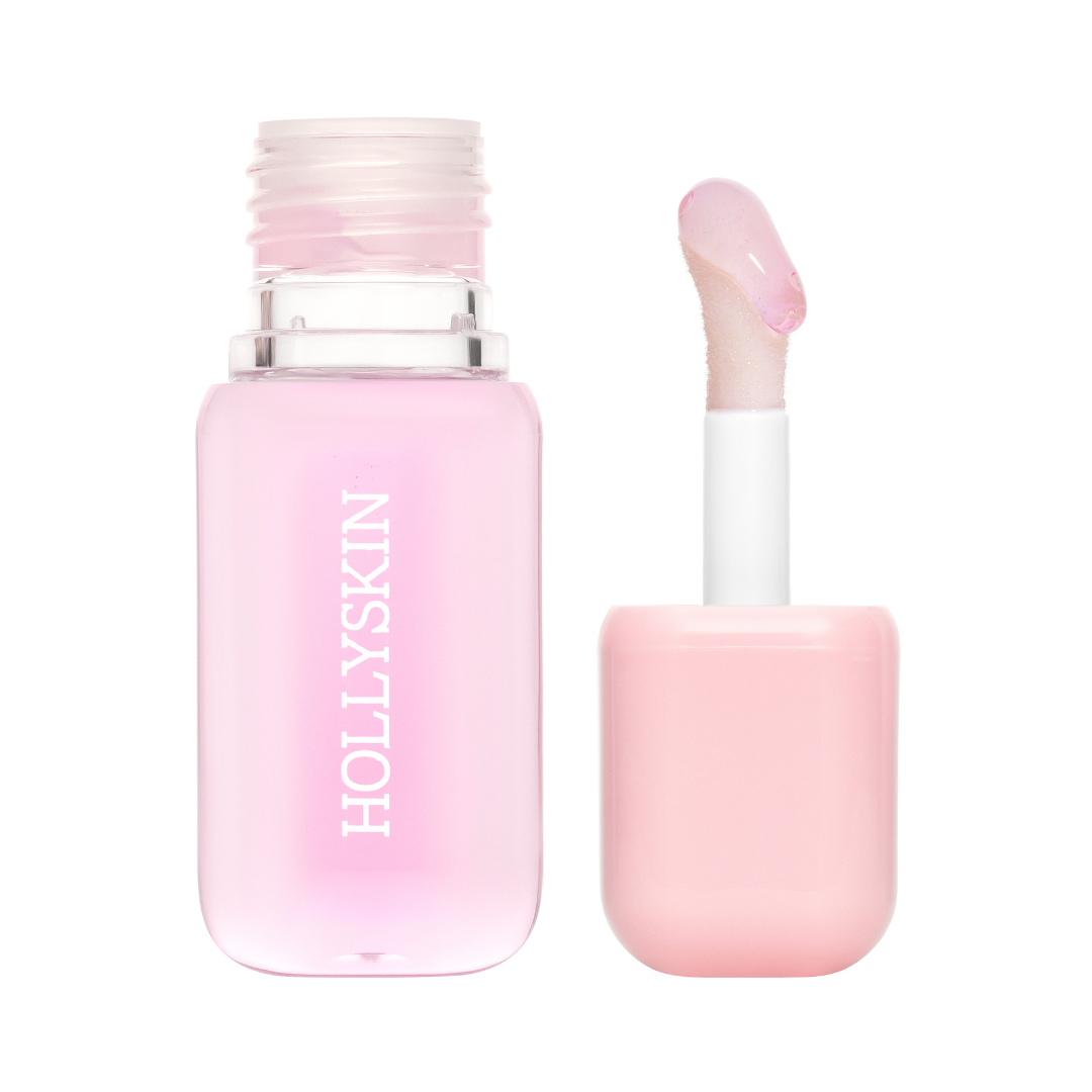 Pink lip balm with applicator on a white background