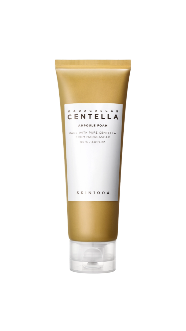 Skincare tube with gold and white design on a white background