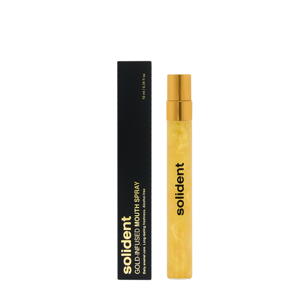 Solident gold-infused mouth spray with black packaging on a white background