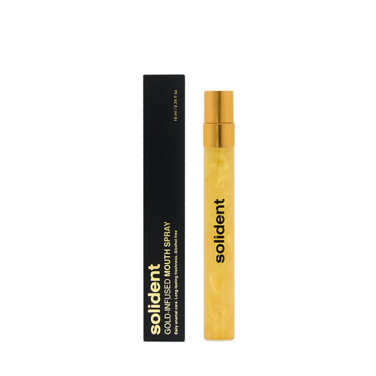 Solident gold-infused mouth spray with black packaging on a white background