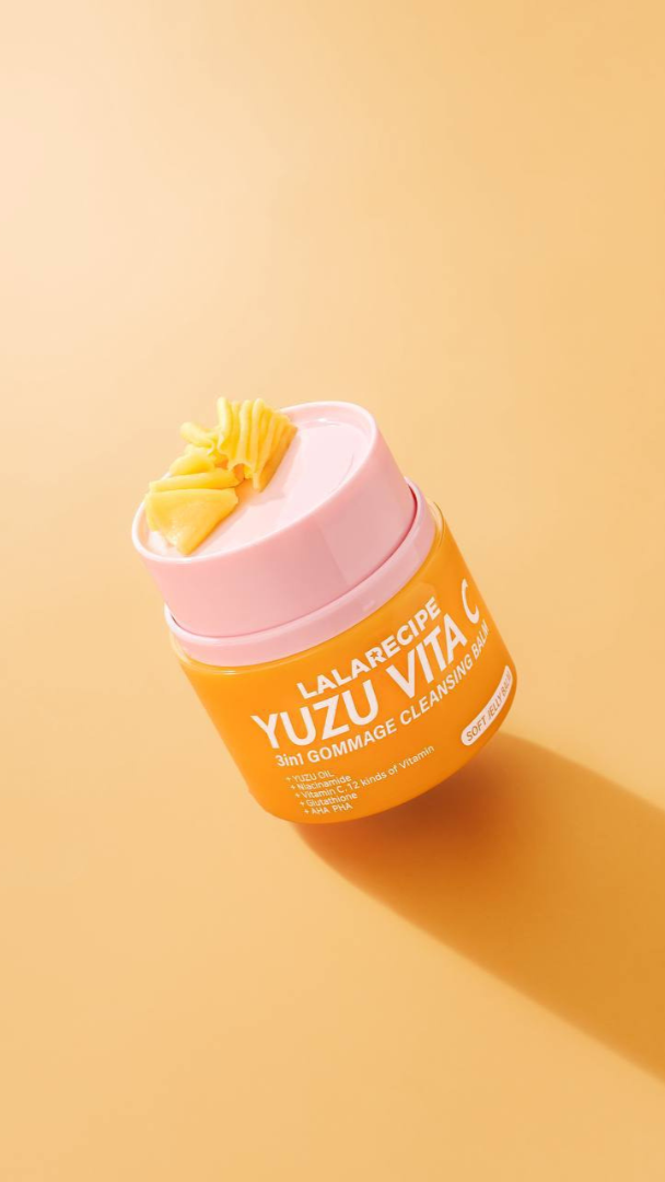 Jar of Lalacrea Yuzu Vita C Dermo-Cleanser on a yellow background