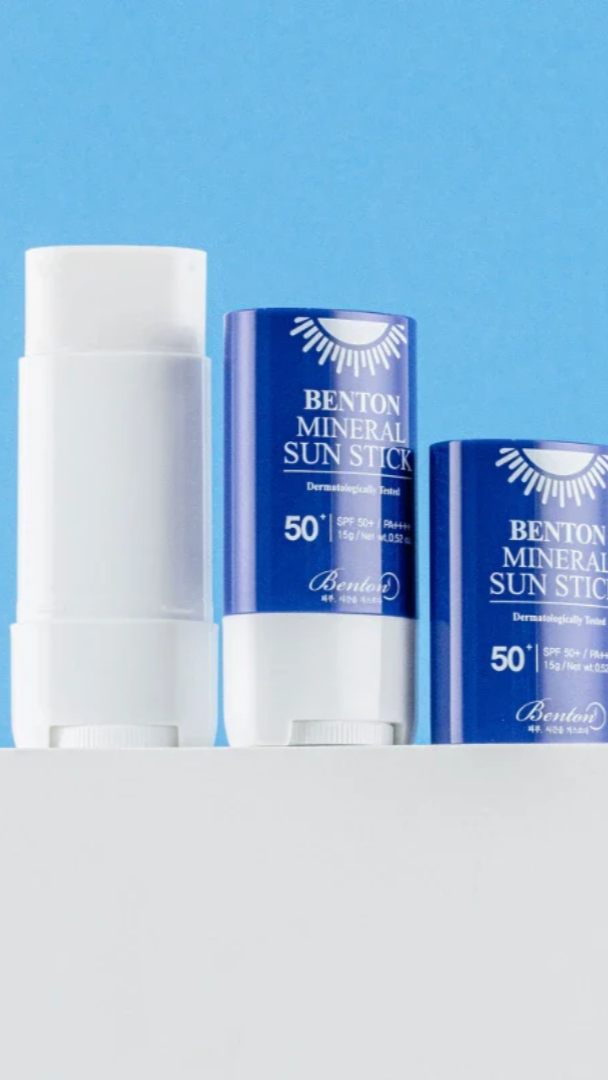 Benton Mineral Sun Stick with blue packaging on a white and blue background