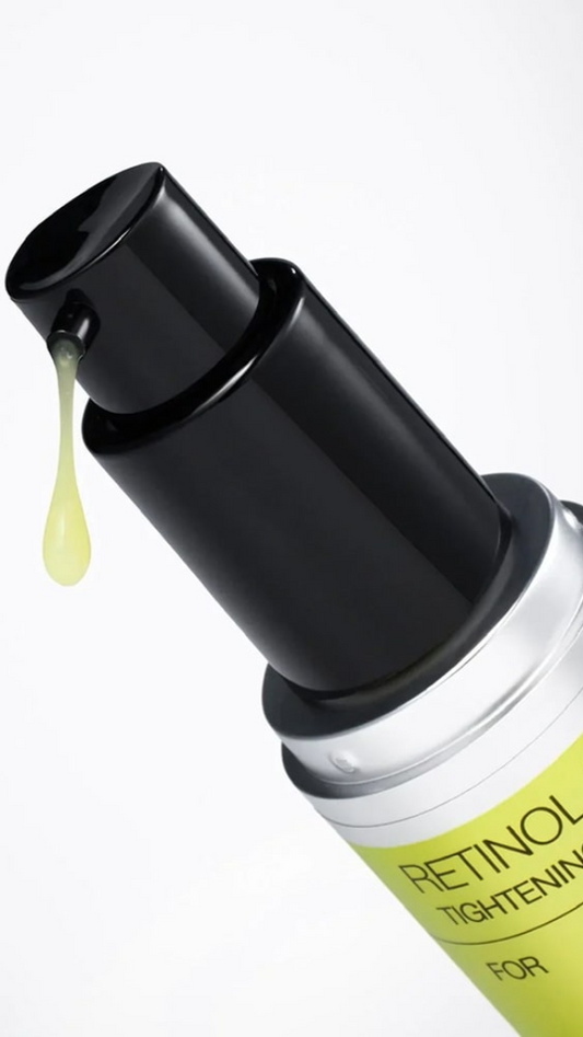 Skincare serum bottle with dropper on a white background