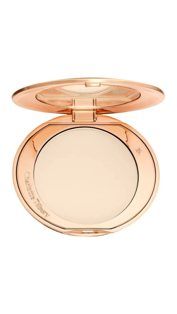 Compact powder in a rose gold case on a white background