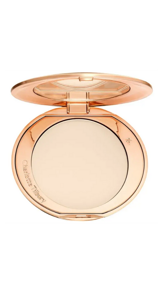 Compact powder in a rose gold case on a white background