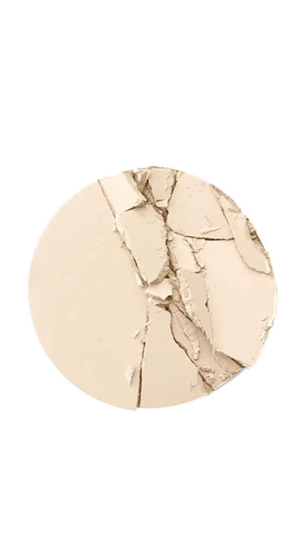 Round makeup compact with a gold and beige color swatch on a white background