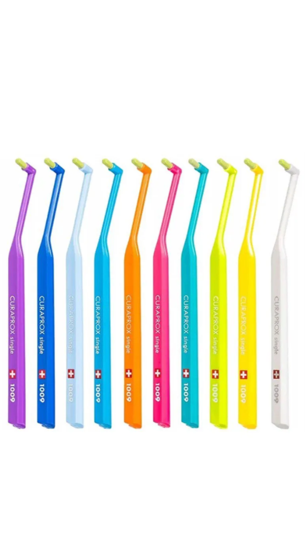 Set of colorful dental tools with visible brand logo on a white background