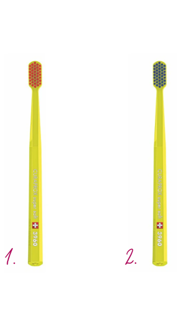 Two yellow toothbrushes with different bristle designs on a white background