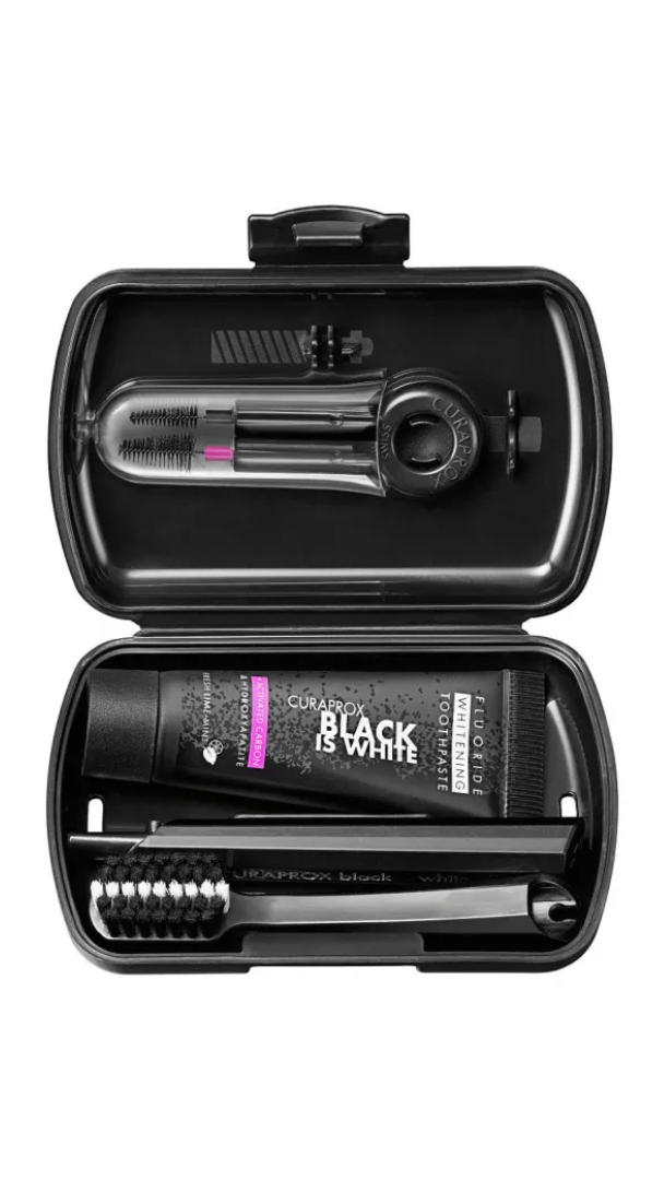 Black and white dental tool set in a case on a white background