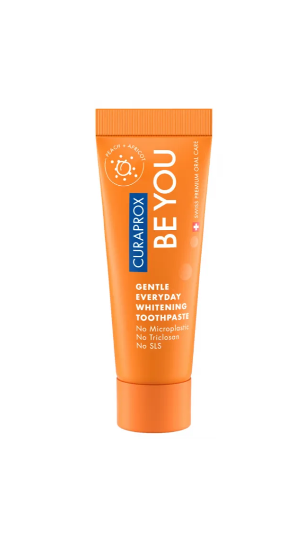 Orange Curaprox BE YOU toothpaste tube on a white background