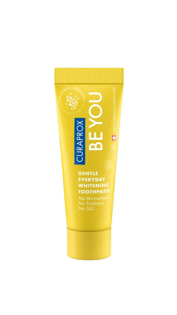Yellow tube of Curaprox BE YOU toothpaste on a white background