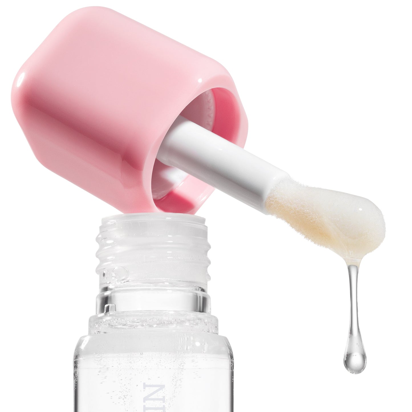Skincare dropper with pink cap and clear liquid dripping into a bottle labeled 'Sculpted Skin' on a white background.